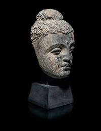 A Gandharan Grey Schist Head of Buddha