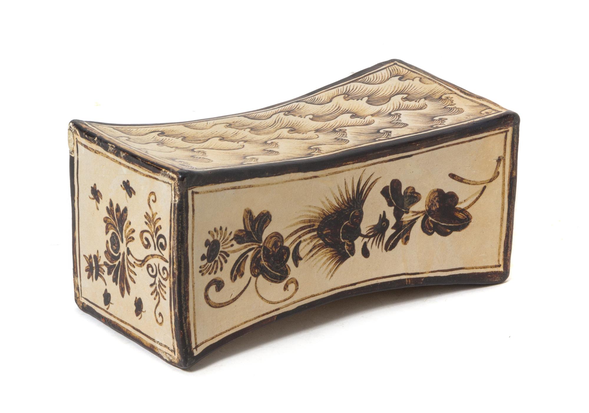 A Cizhou Stoneware Pillow Length 9 3/8 x width 4 5/8 x height 4 5/8 inches.