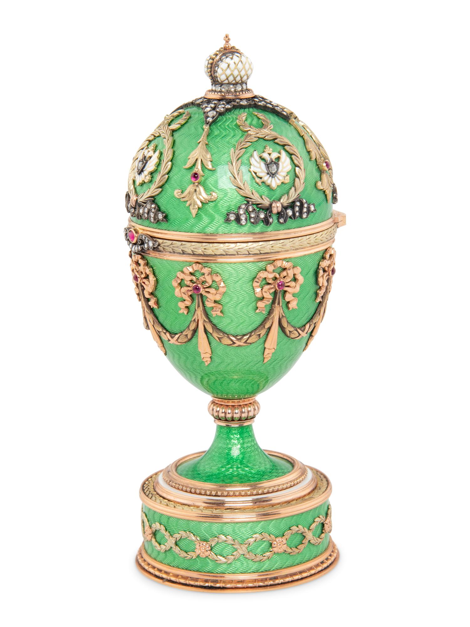 A Gold, Guilloché Enamel and Gemstone-Mounted Surprise Egg