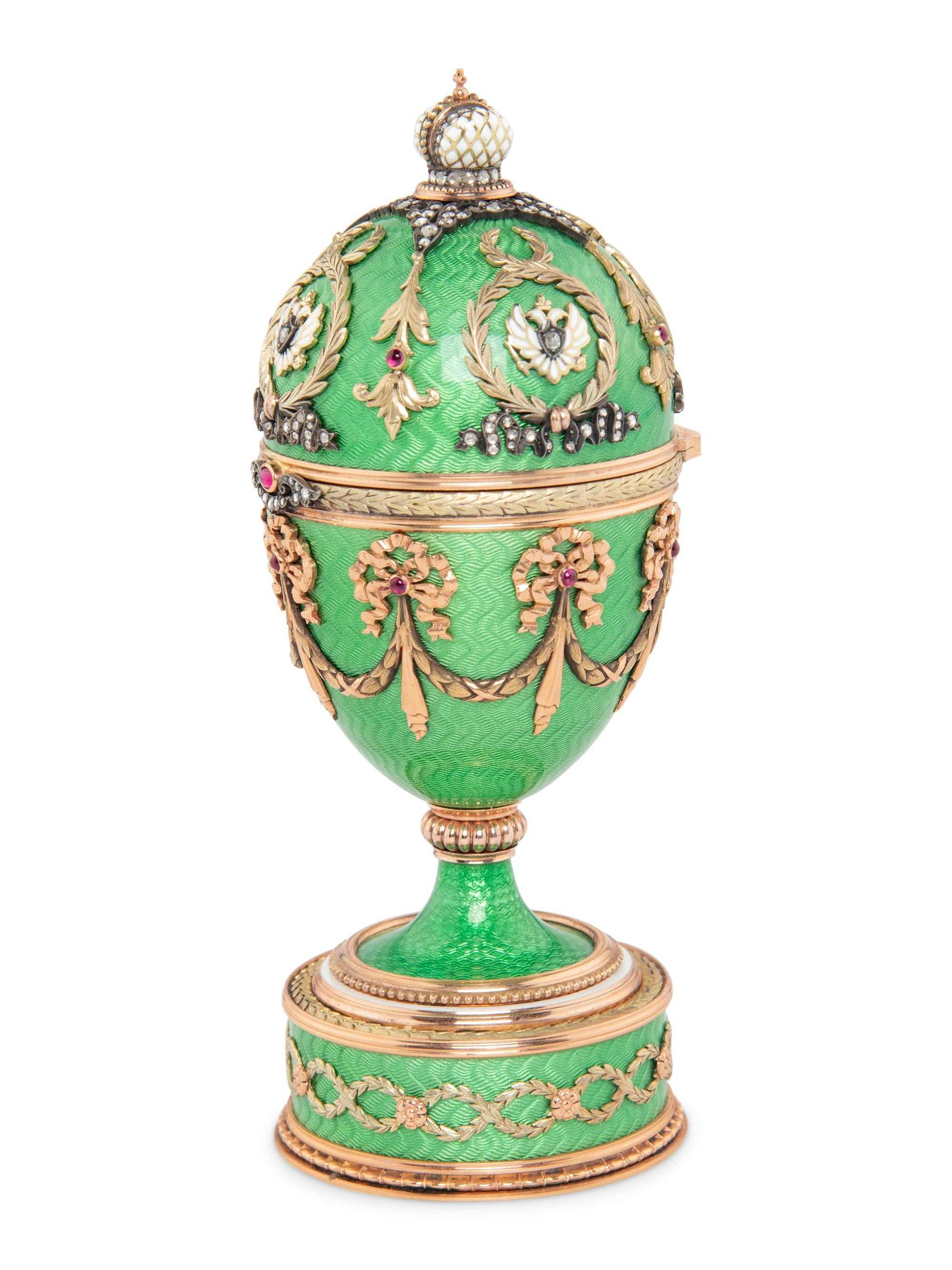 A Gold, Guilloché Enamel and Gemstone-Mounted Surprise Egg