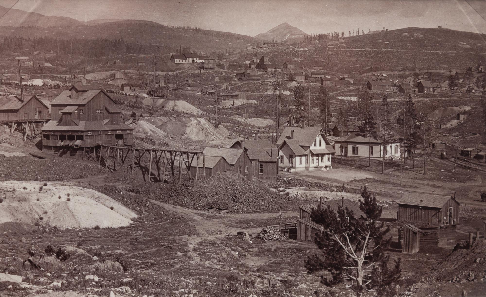 A group of four photographs (8098. Panorama of Denver; Untitled (roof tops of a town; Untitled (mining town); Georgetown)