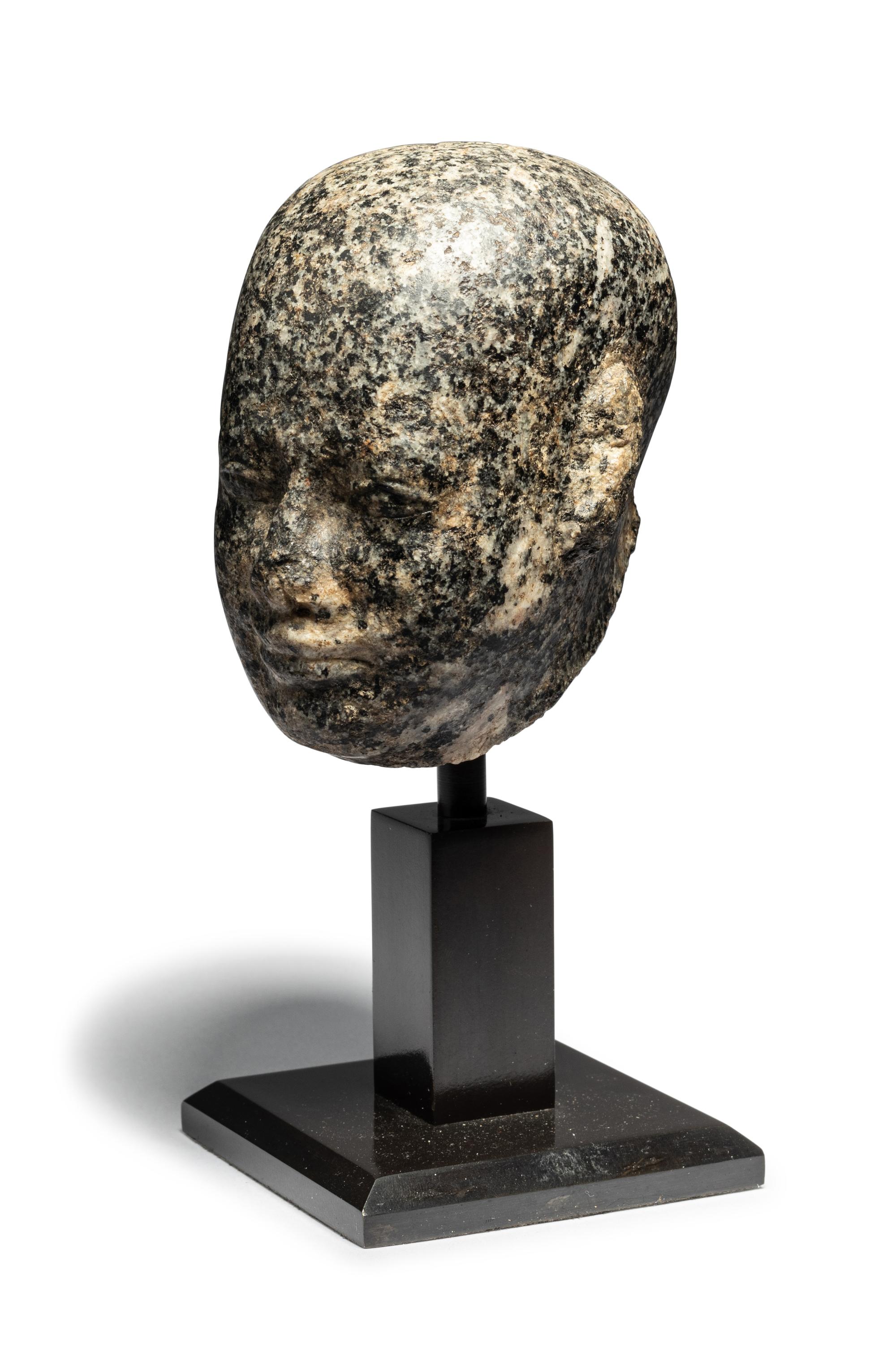 An Egyptian Stone Head of a Priest