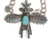 A Silver and Turquoise Pendant