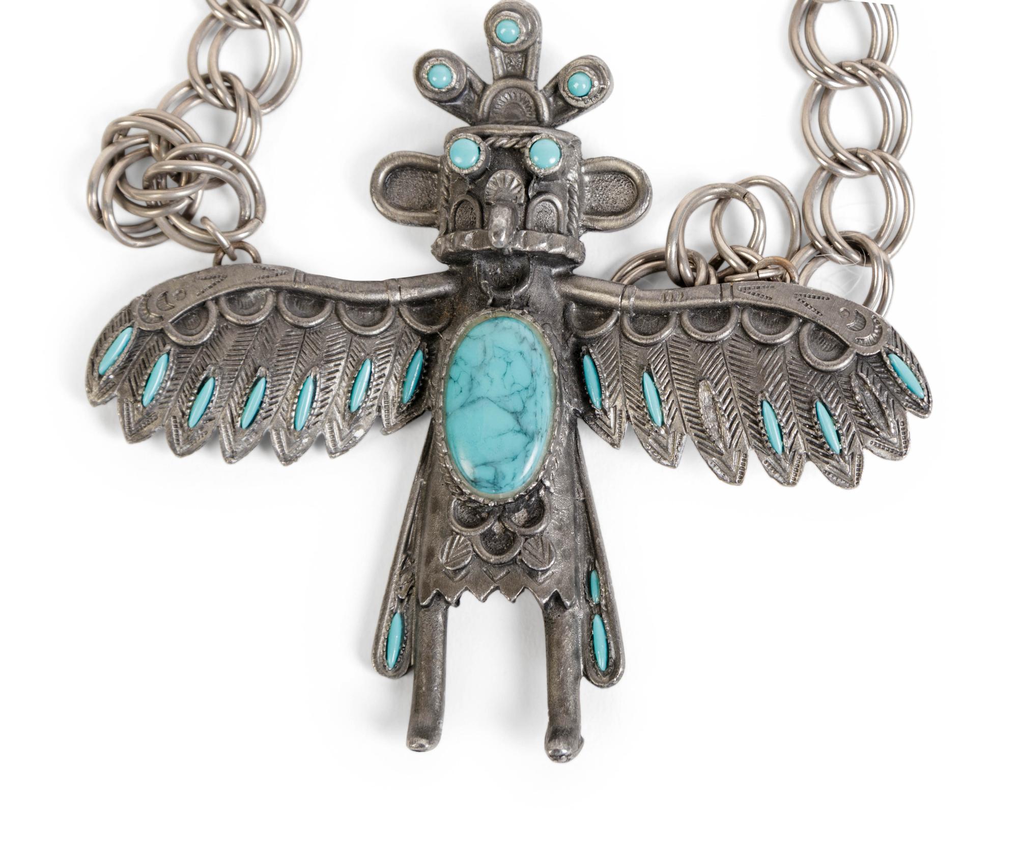 A Silver and Turquoise Pendant