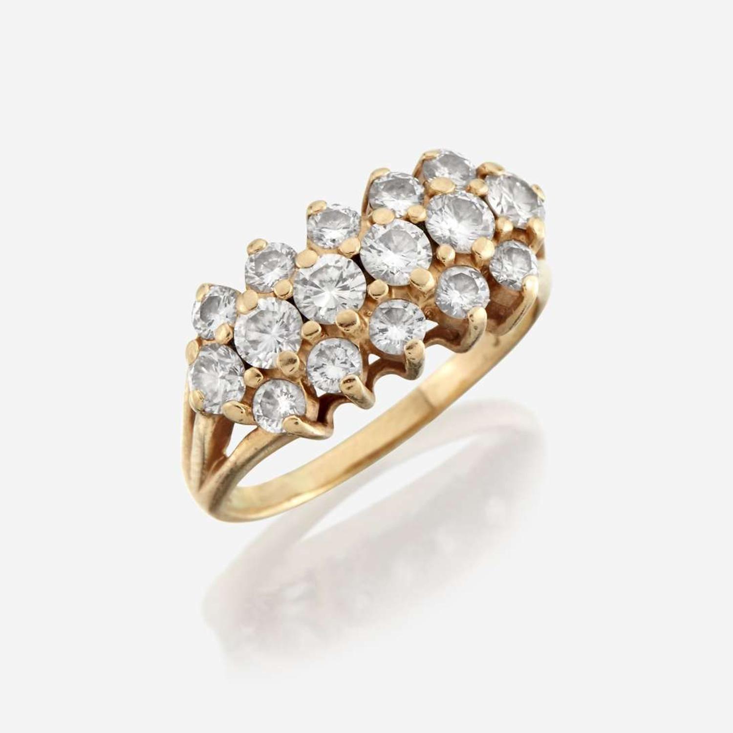 A diamond and fourteen karat gold ring