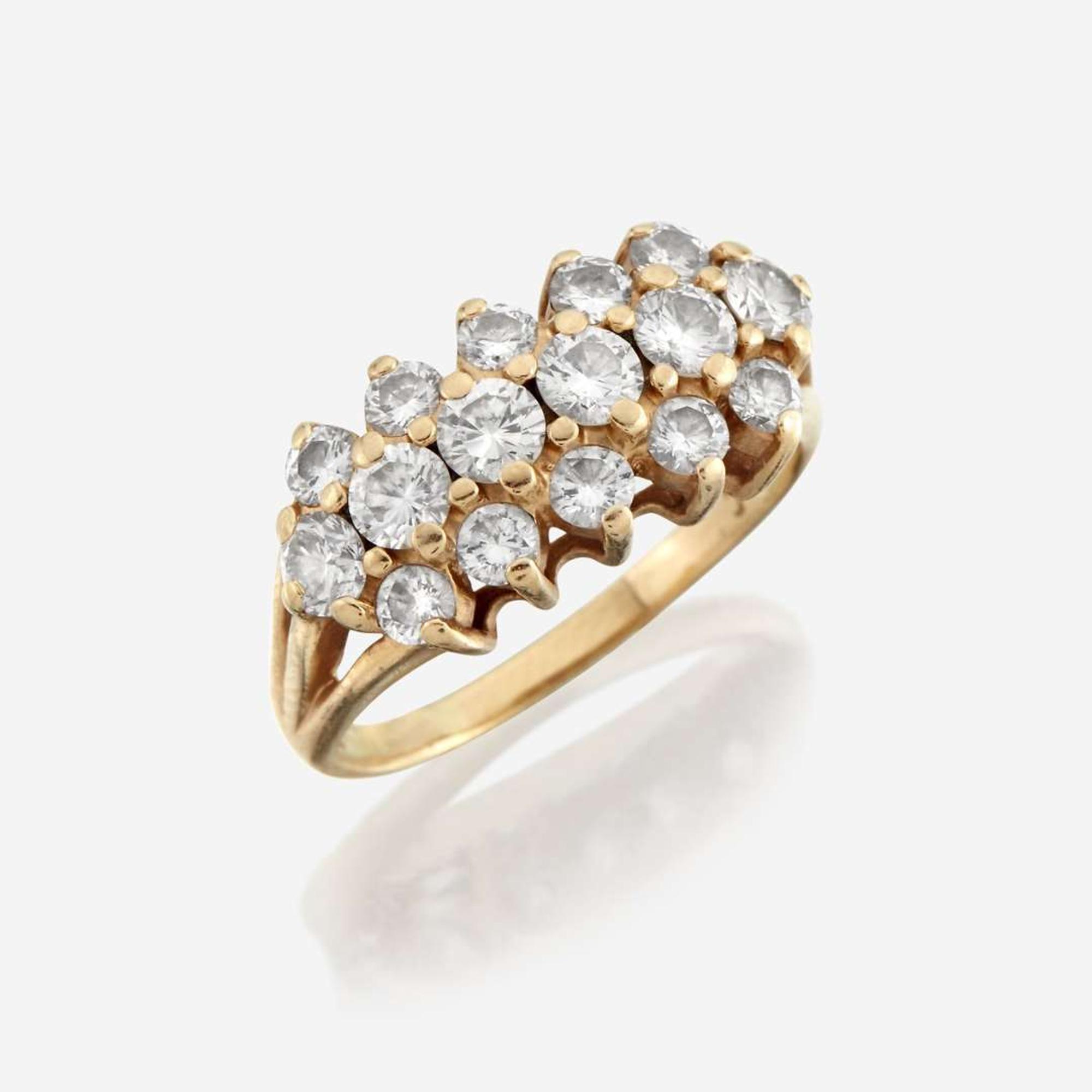 A diamond and fourteen karat gold ring
