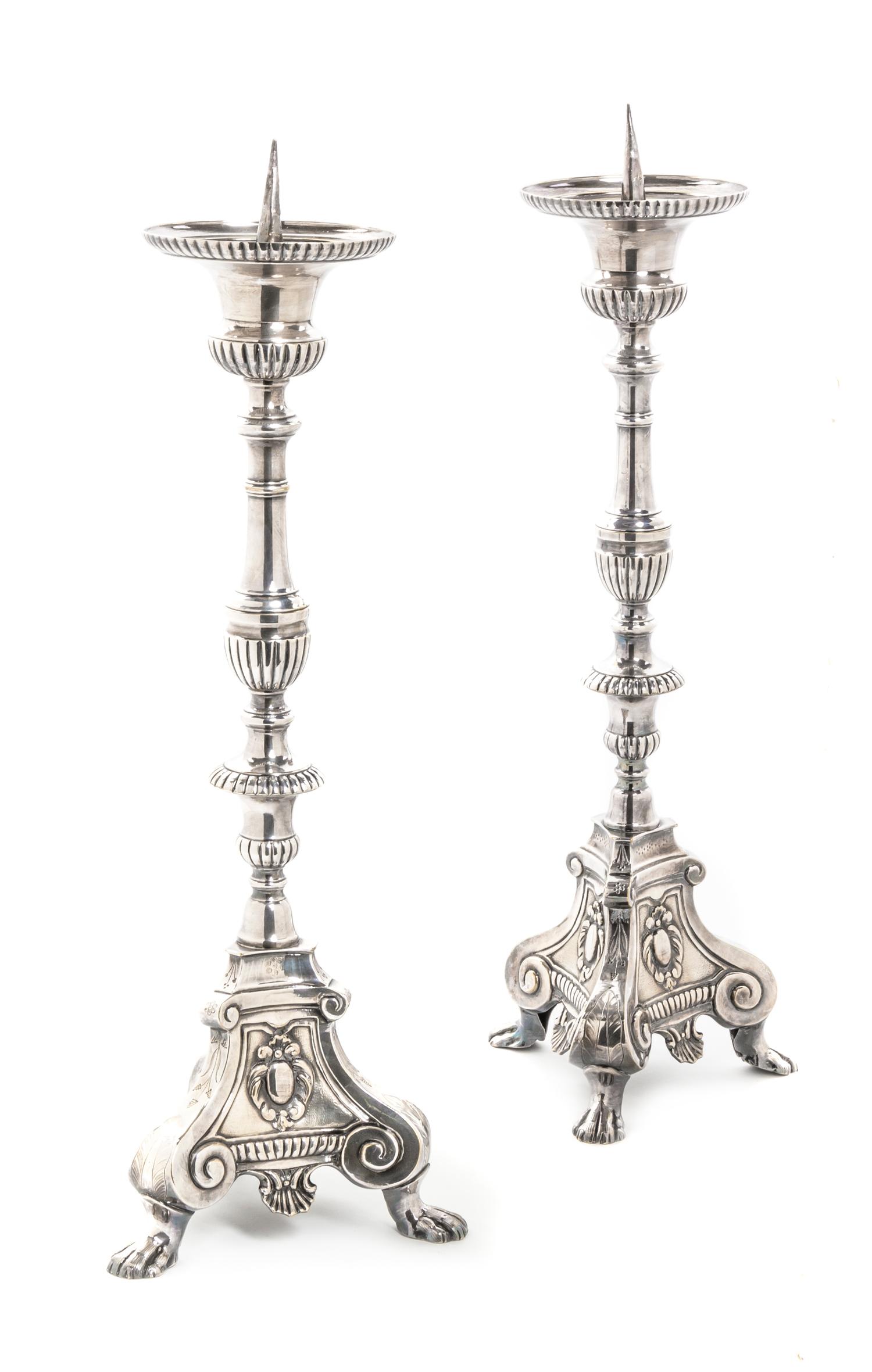 A Pair of Silvered Pricket Sticks, Height 22 1/2 inches.