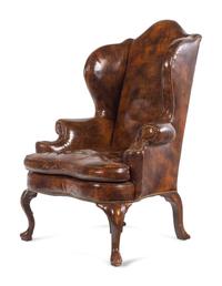 A Queen Anne Style Faux Leather Upholstered Wingback Armchair