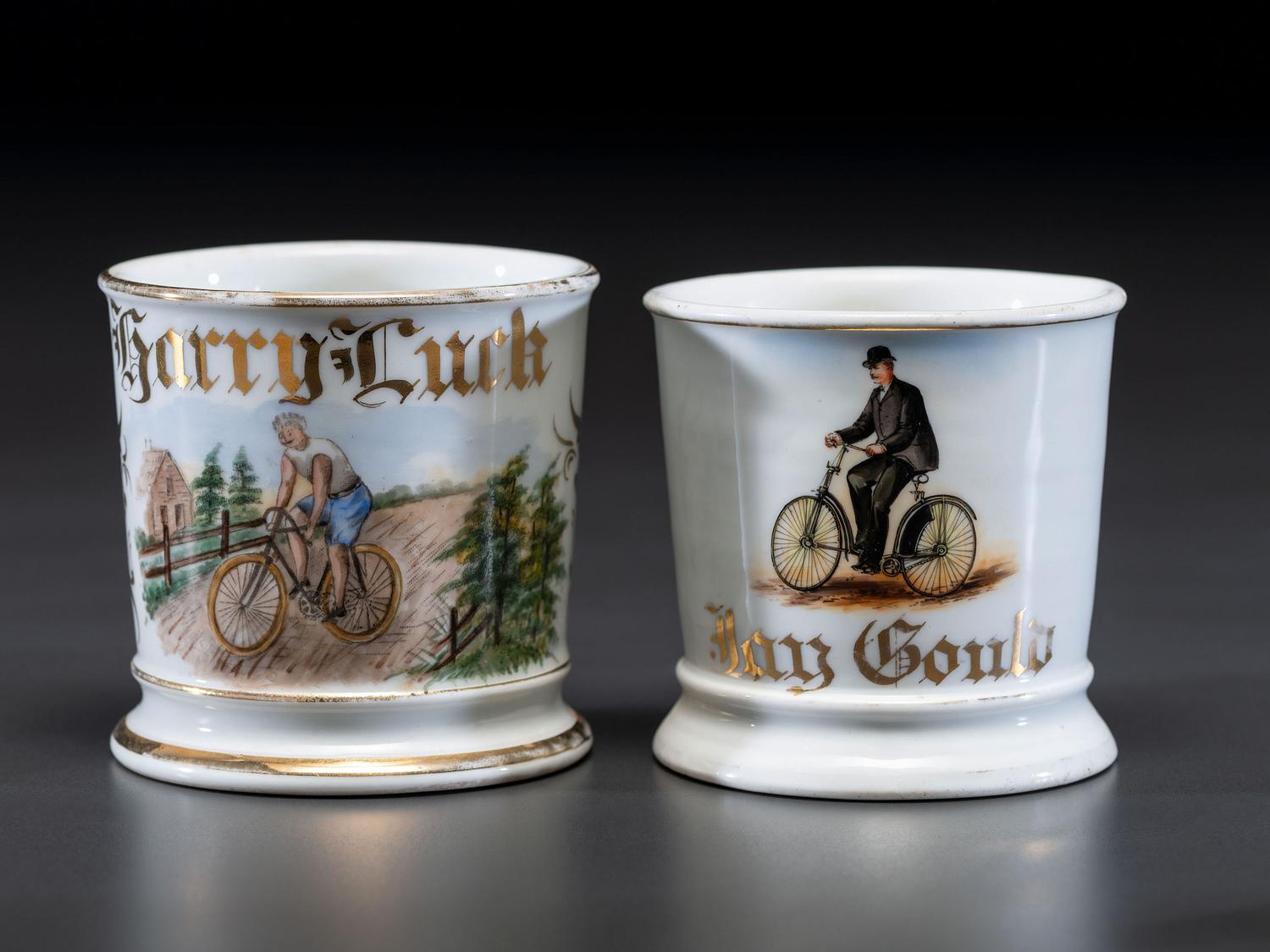 Two Cyclist's Porcelain Shaving Mugs