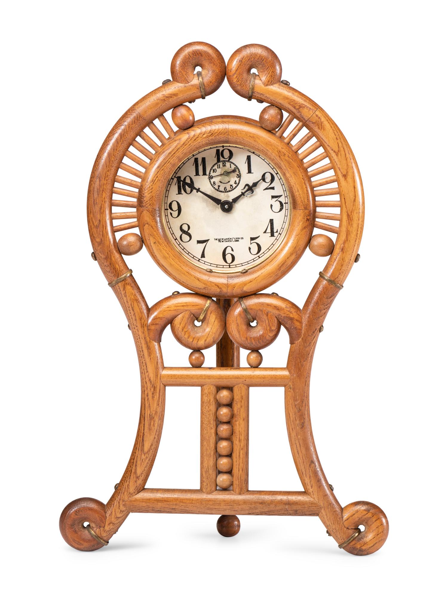 A Stick and Ball Oak Mantel Clock