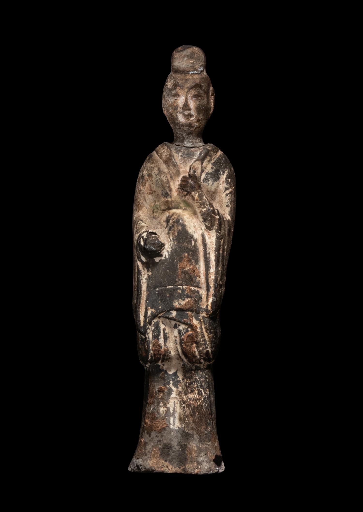 A Chinese Pottery Figure of a Standing Scholar