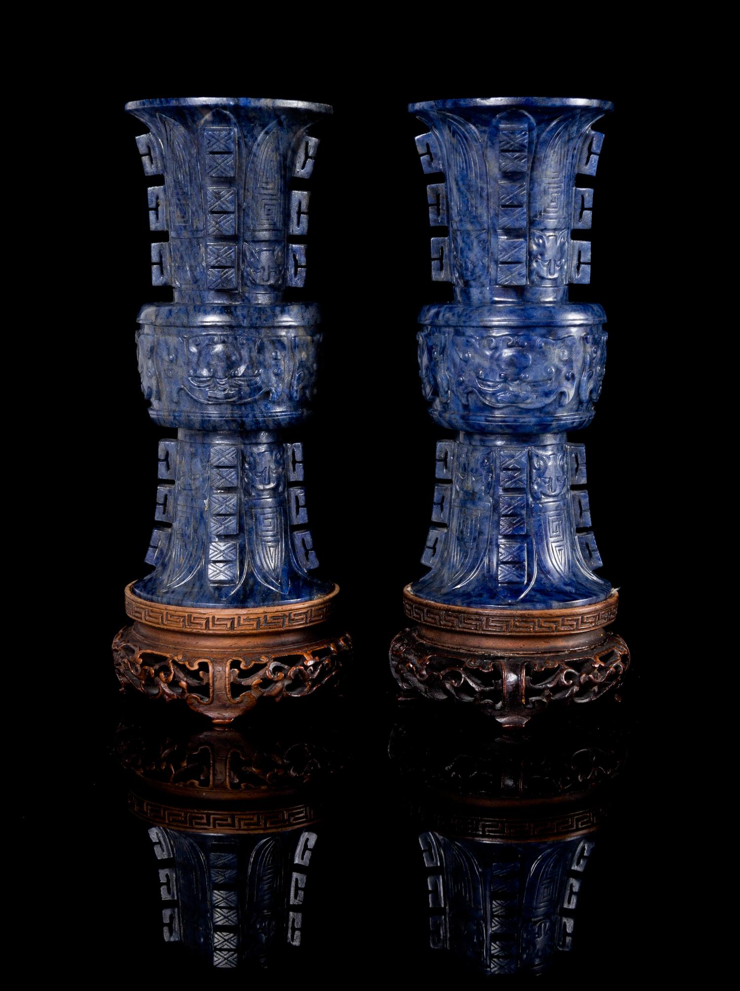 A Pair of Carved Hardstone Gu-Form Miniature Vases Height of each 4 inches.