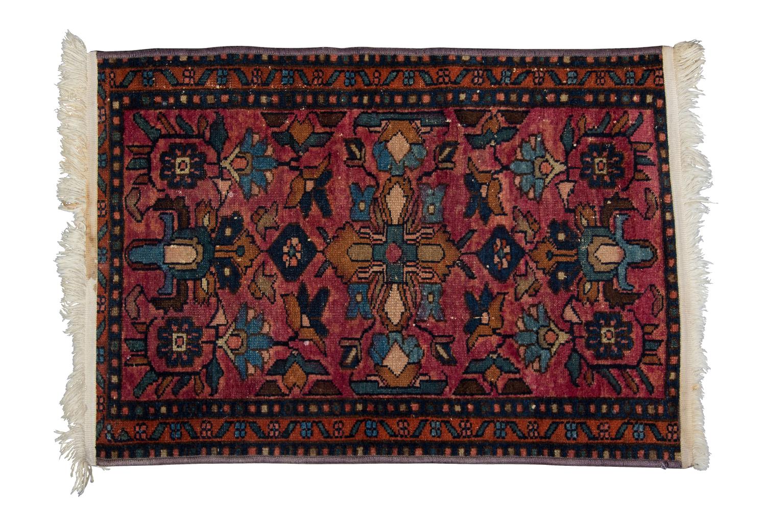 A Persian Wool Rug 2 feet 7 x 1 foot 10 inches.