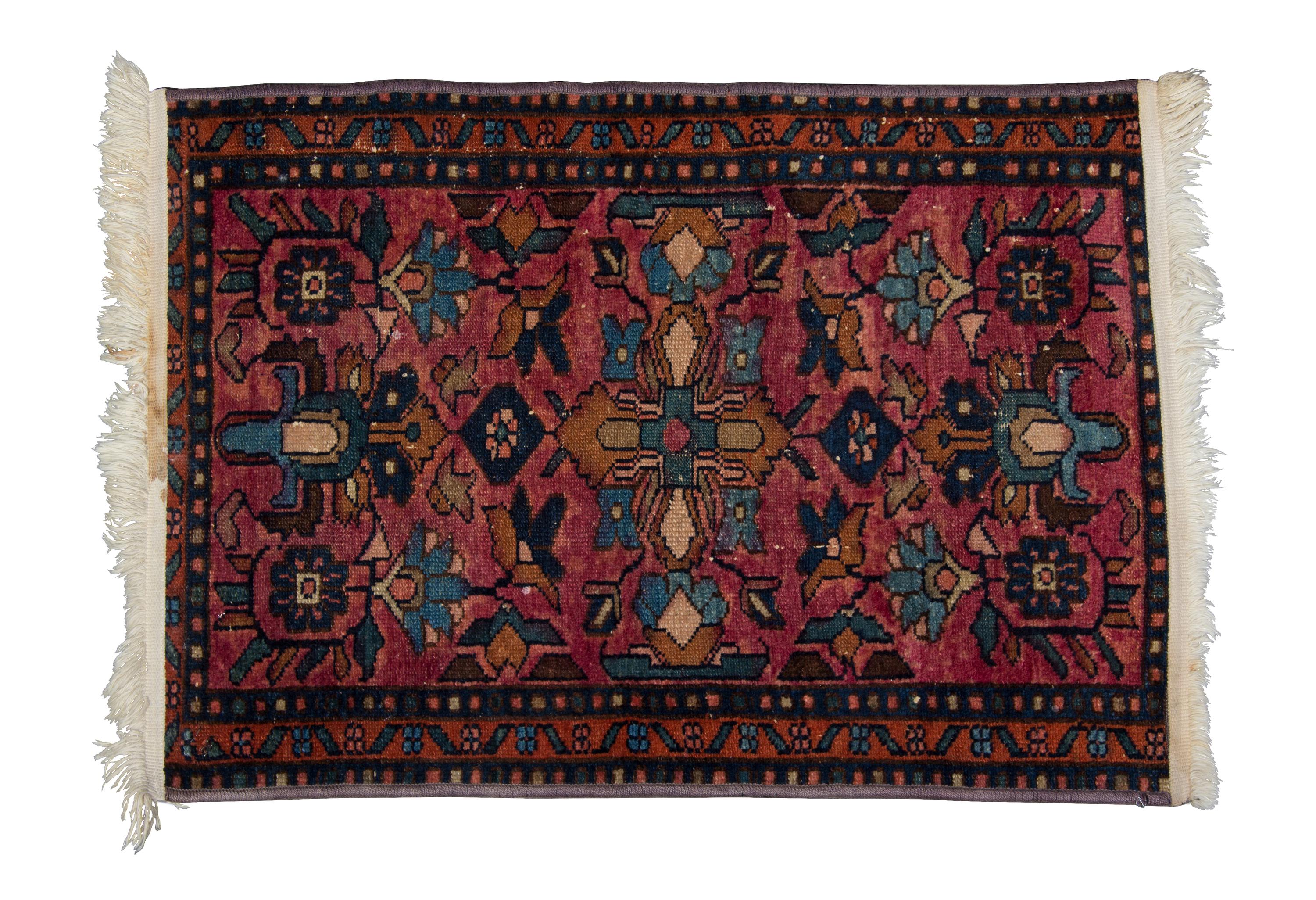 A Persian Wool Rug 2 feet 7 x 1 foot 10 inches.