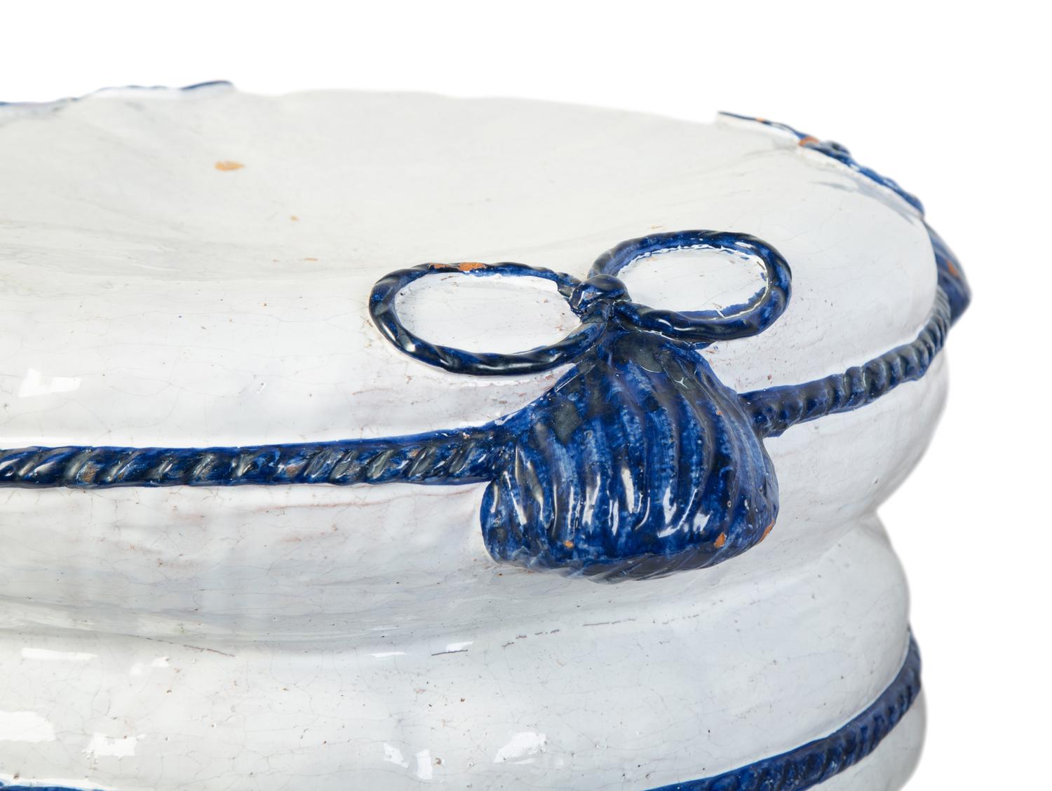 A Pair of Italian Glazed Terracotta Pillow-Form Stools — 20TH CENTURY