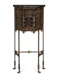 An Art Deco Demilune Gilt Iron and Brass Marble Top Cabinet