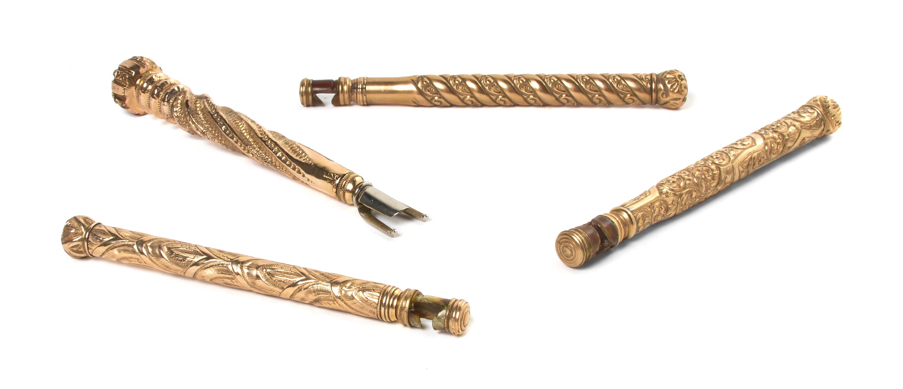 Four Gold Toned Metal Opera Glass Holders, Length of longest 6 1/4 inches (closed).