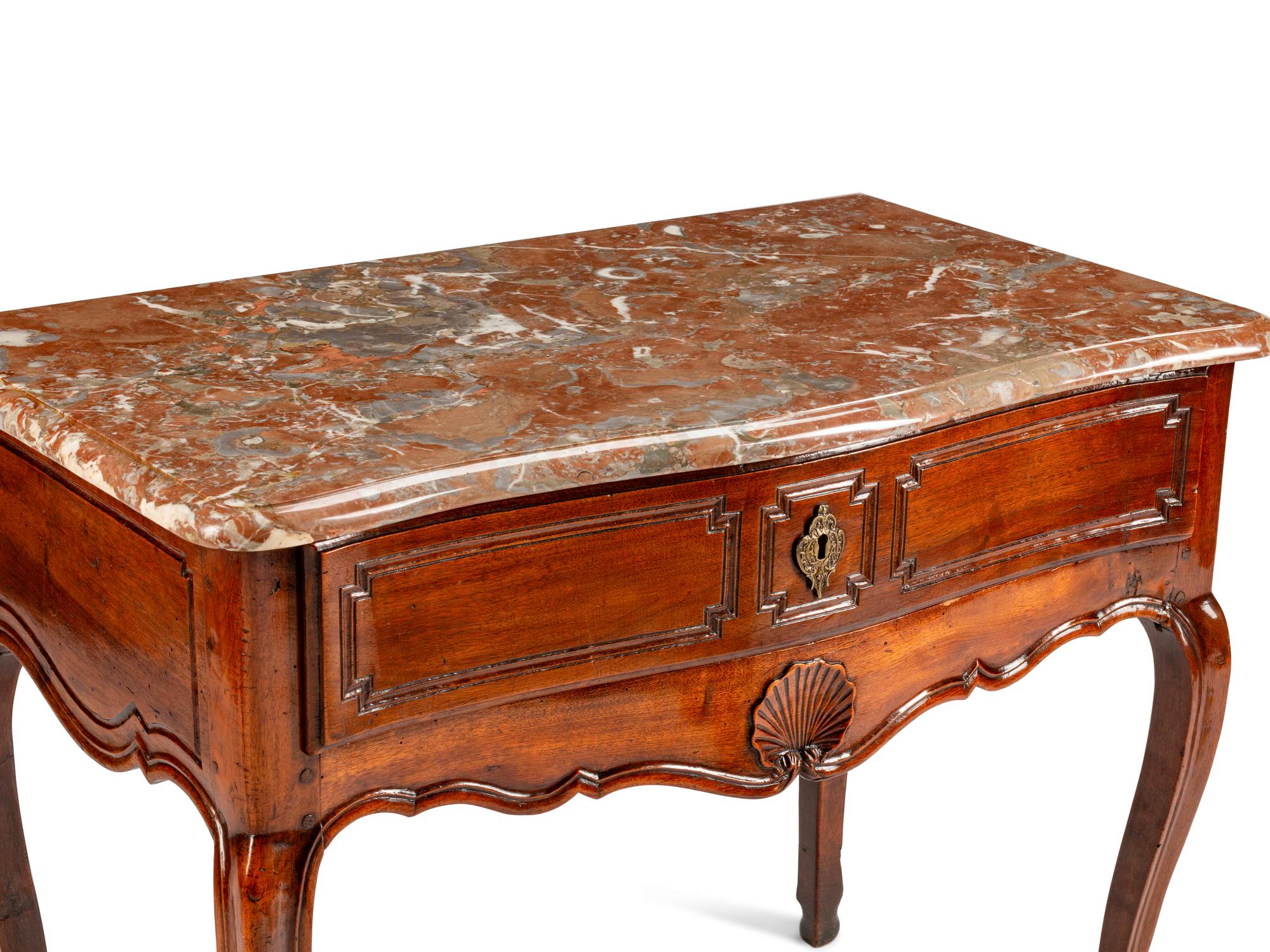 A Louis XV Provincial Carved Walnut Table