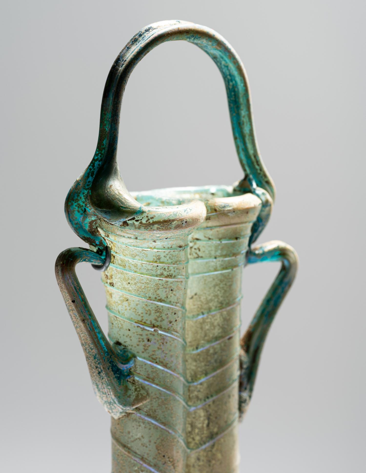 A Roman Green Glass Double Unguentarium