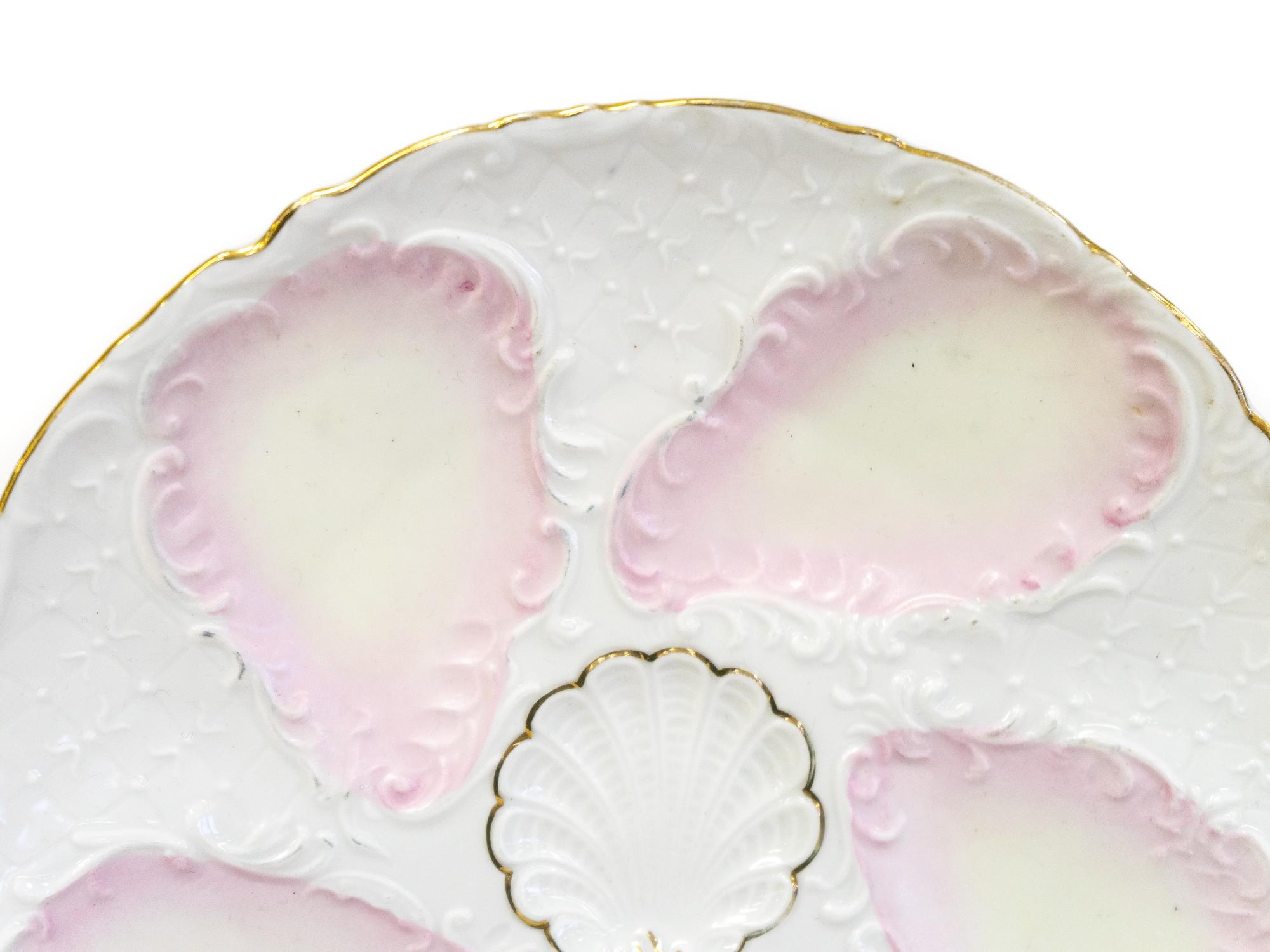 A Set of Six French Porcelain Oyster Plates