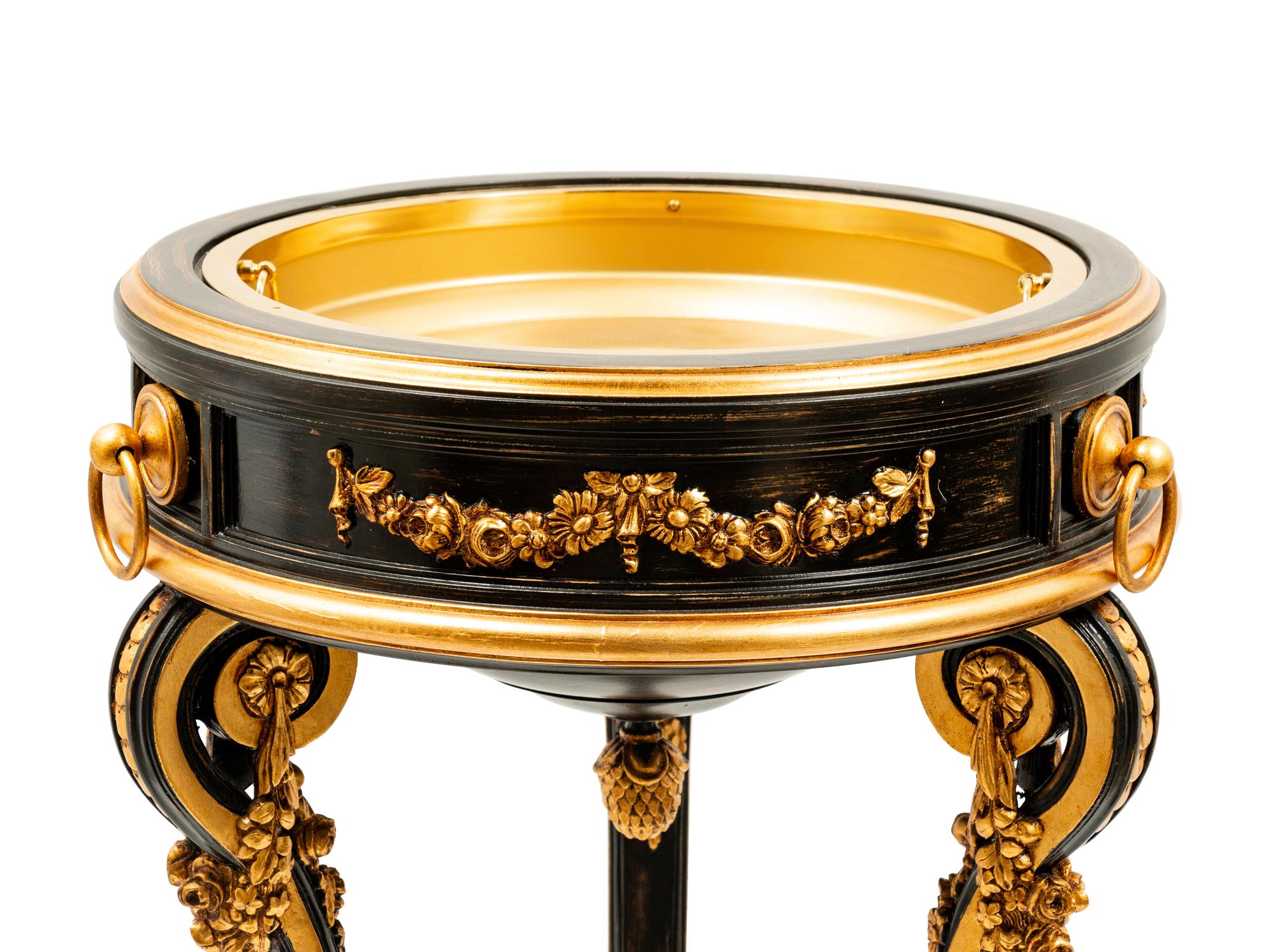 A Napoleon III Style Parcel Gilt and Ebonized Jardiniere and Flat Top Pedestal Stand