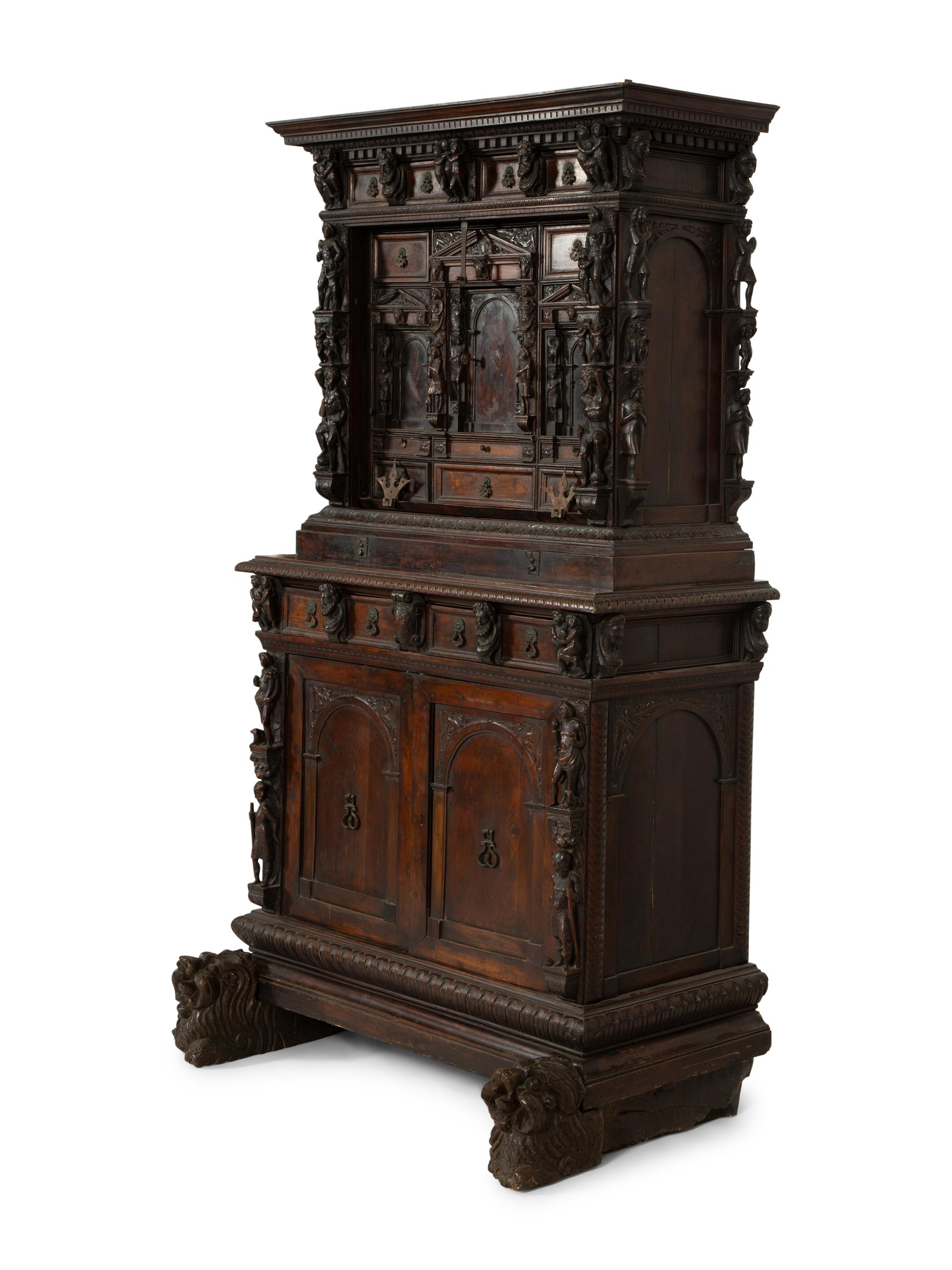 A Continental Baroque Walnut Cabinet