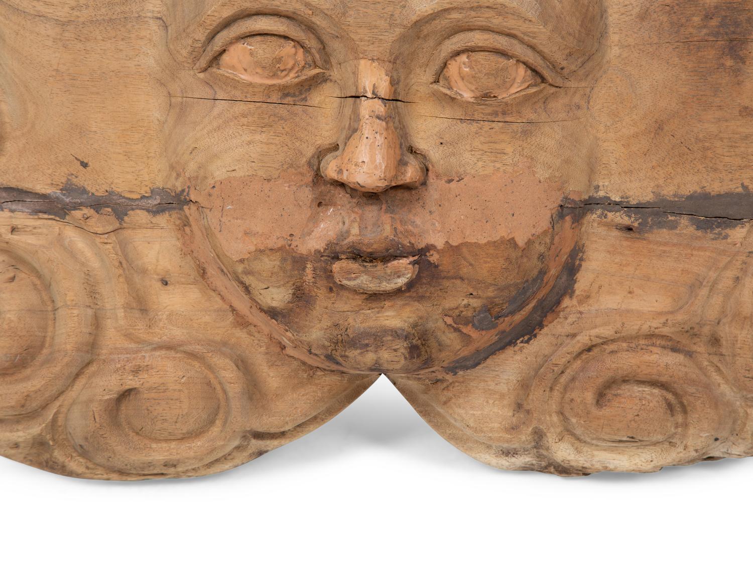 A Continental Carved Wood Face-Form Wall Plaque — 19TH CENTURY