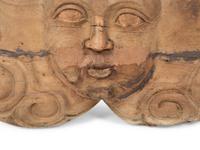 A Continental Carved Wood Face-Form Wall Plaque — 19TH CENTURY