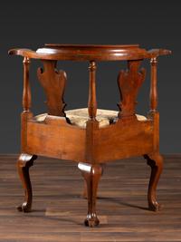 A Queen Anne Carved Walnut Knuckle-Arm and Trifid Foot Corner Chair