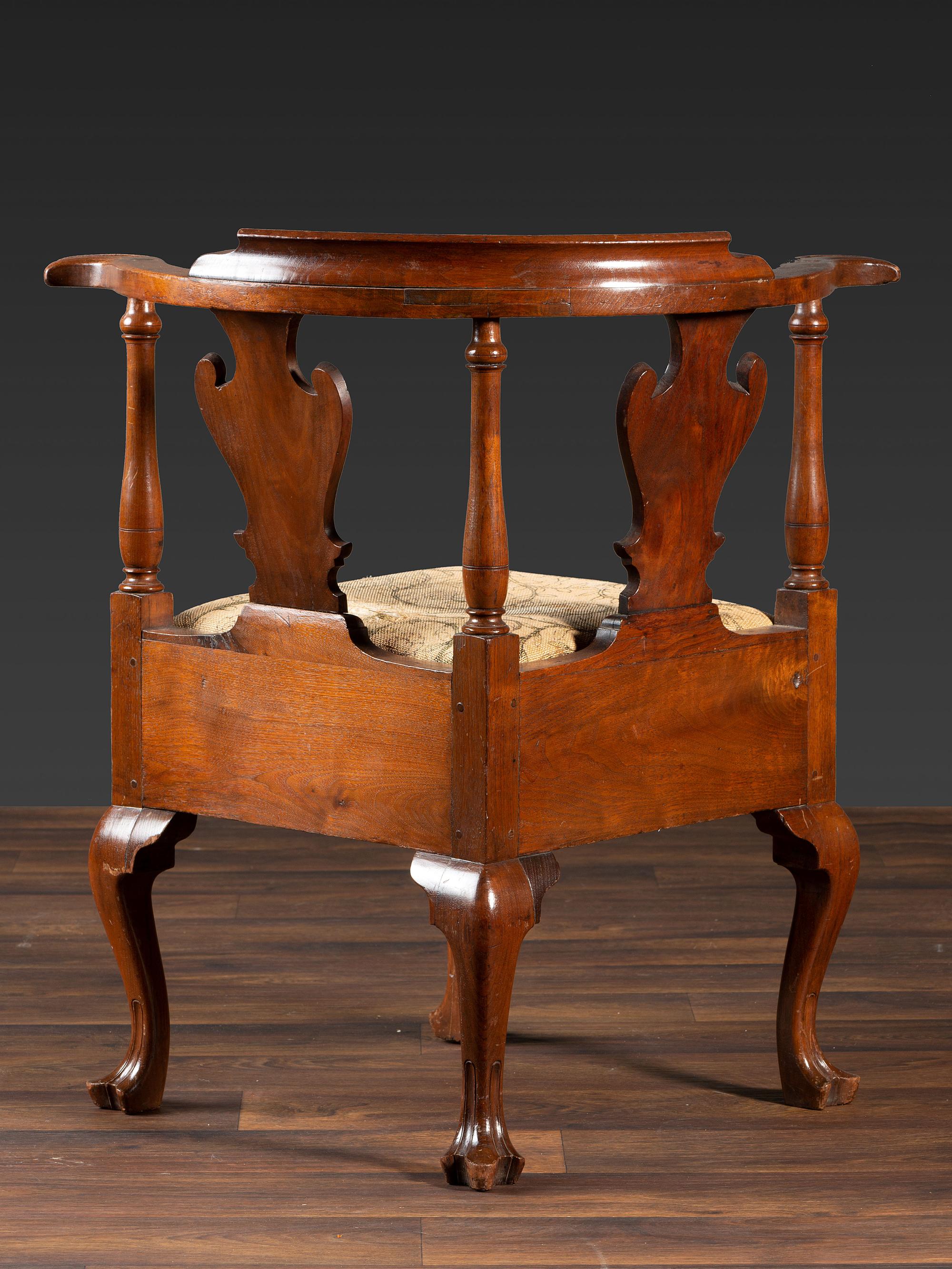 A Queen Anne Carved Walnut Knuckle-Arm and Trifid Foot Corner Chair