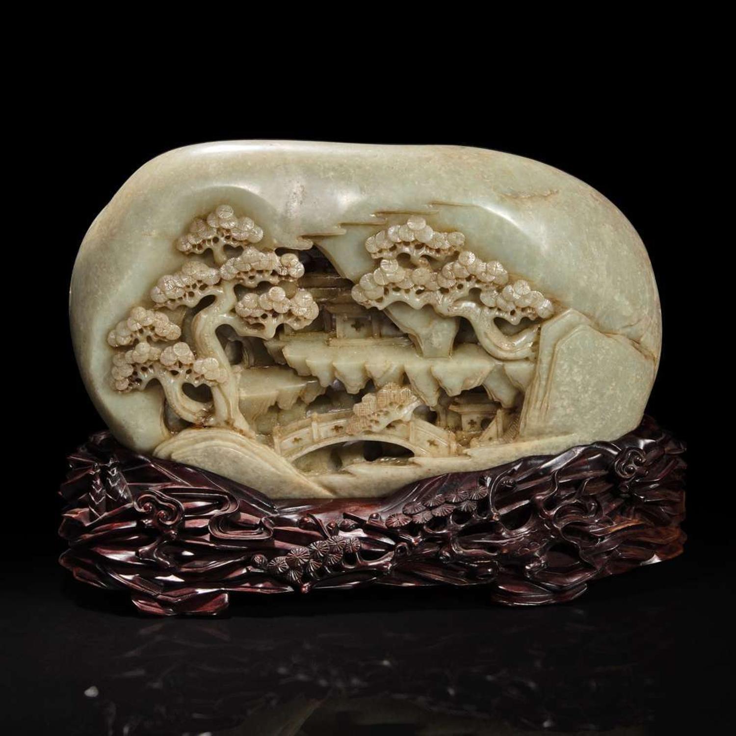 A large Chinese carved greyish celadon jade "Mountain" boulder and carved wood stand 灰青玉山子带底座