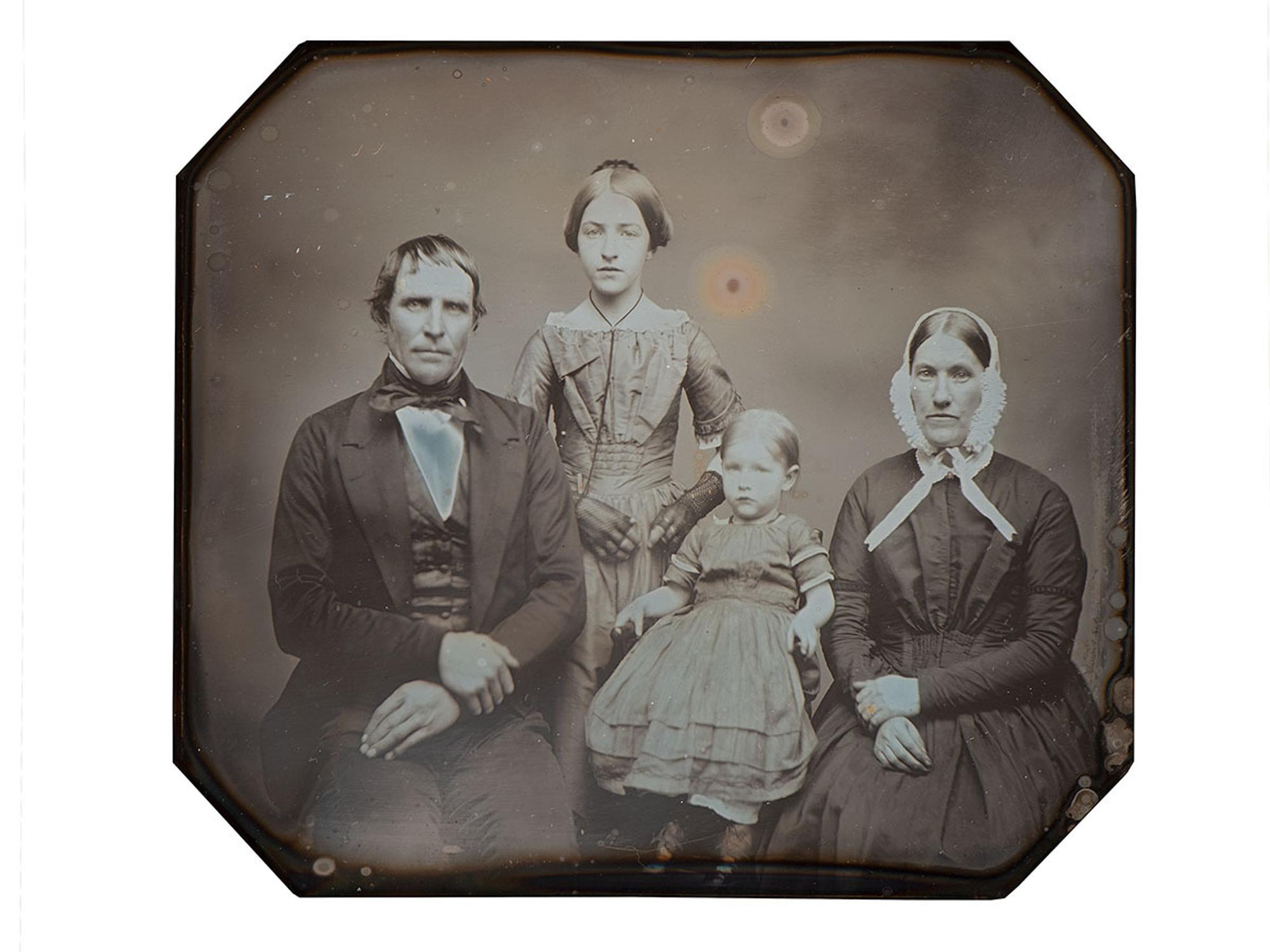 [EARLY PHOTOGRAPHY]. Three-quarter plate daguerreotype of New York farmer and judge Benjamin H. Gorton III, his wife, and daughters.