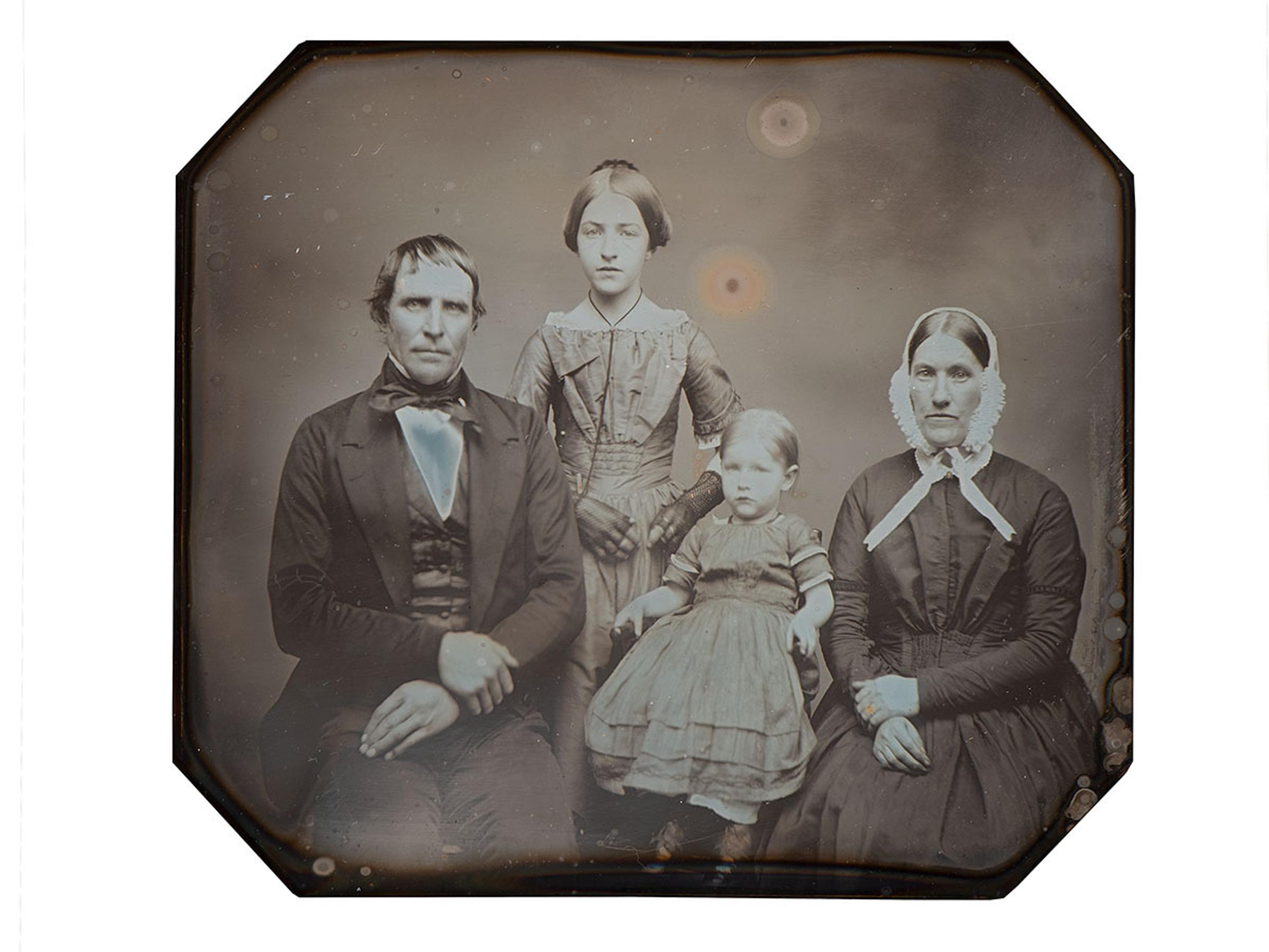 [EARLY PHOTOGRAPHY]. Three-quarter plate daguerreotype of New York farmer and judge Benjamin H. Gorton III, his wife, and daughters.