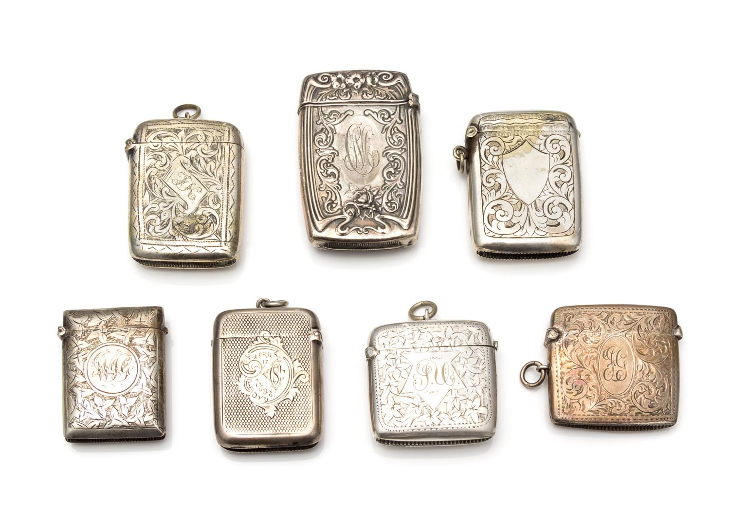 A Collection of Six Silver-Plate Smoking Articles, Various Makers, comprising four vesta cases and two cigarette cases.
