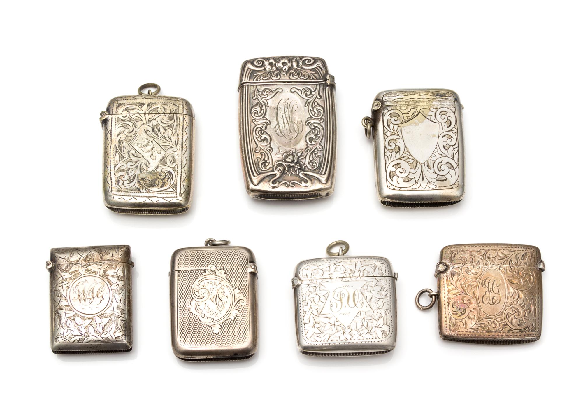 A Collection of Six Silver-Plate Smoking Articles, Various Makers, comprising four vesta cases and two cigarette cases.