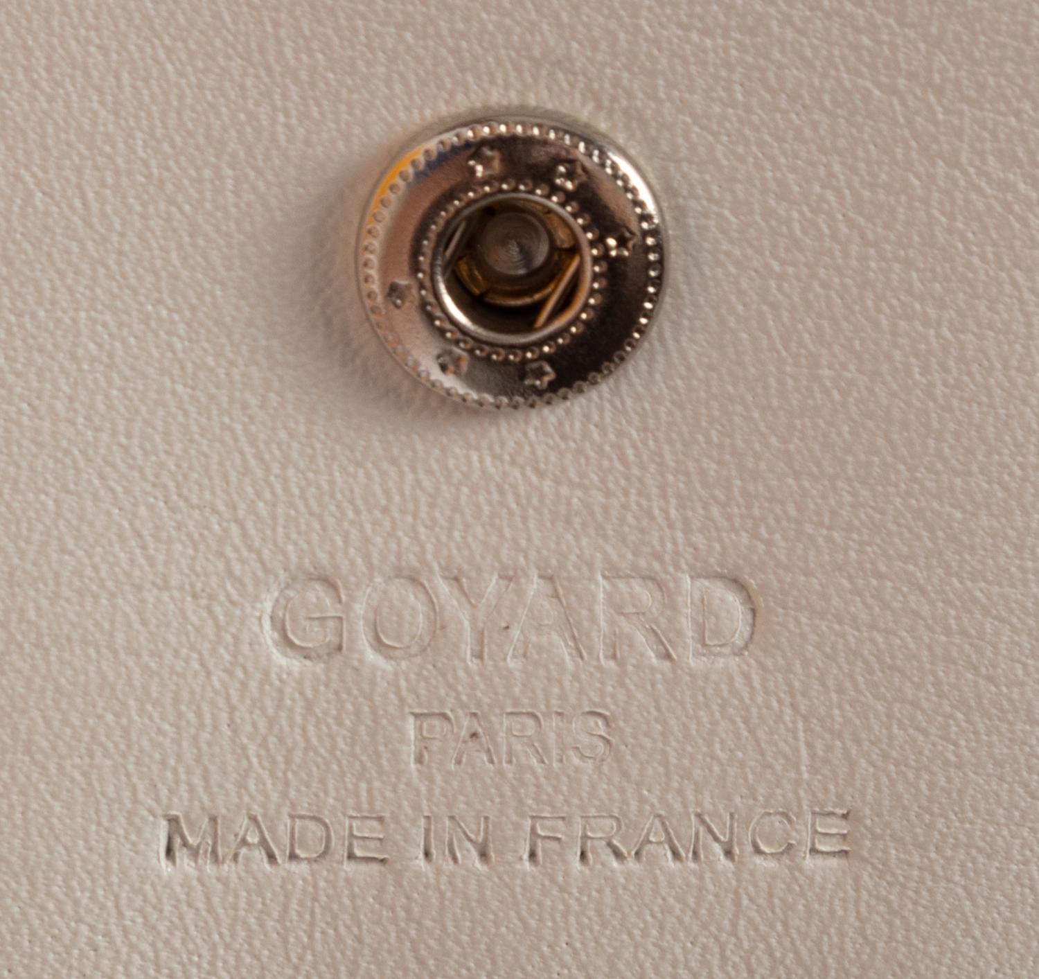 Six Goyard Items: Two Totes, Three Pouches, and One Wallet