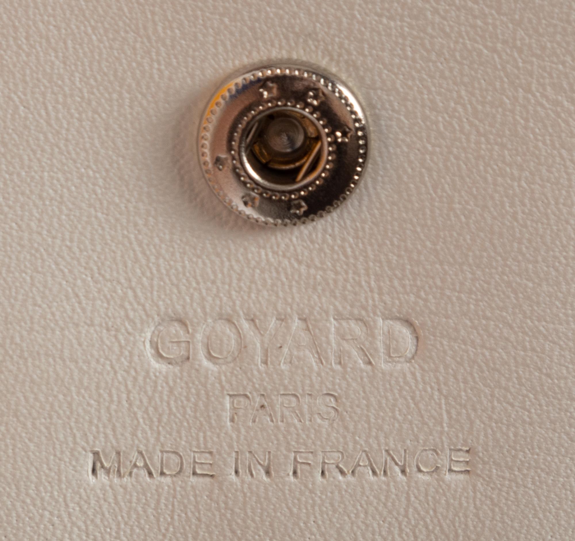 Six Goyard Items: Two Totes, Three Pouches, and One Wallet