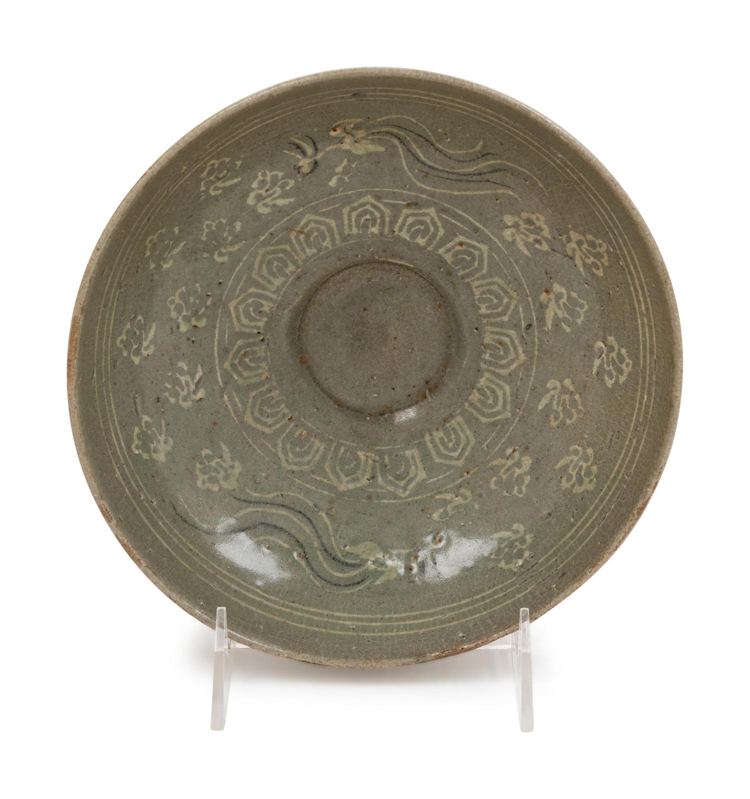 A Slip Decorated Celadon Glazed Ceramic Bowl