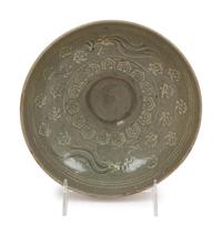 A Slip Decorated Celadon Glazed Ceramic Bowl