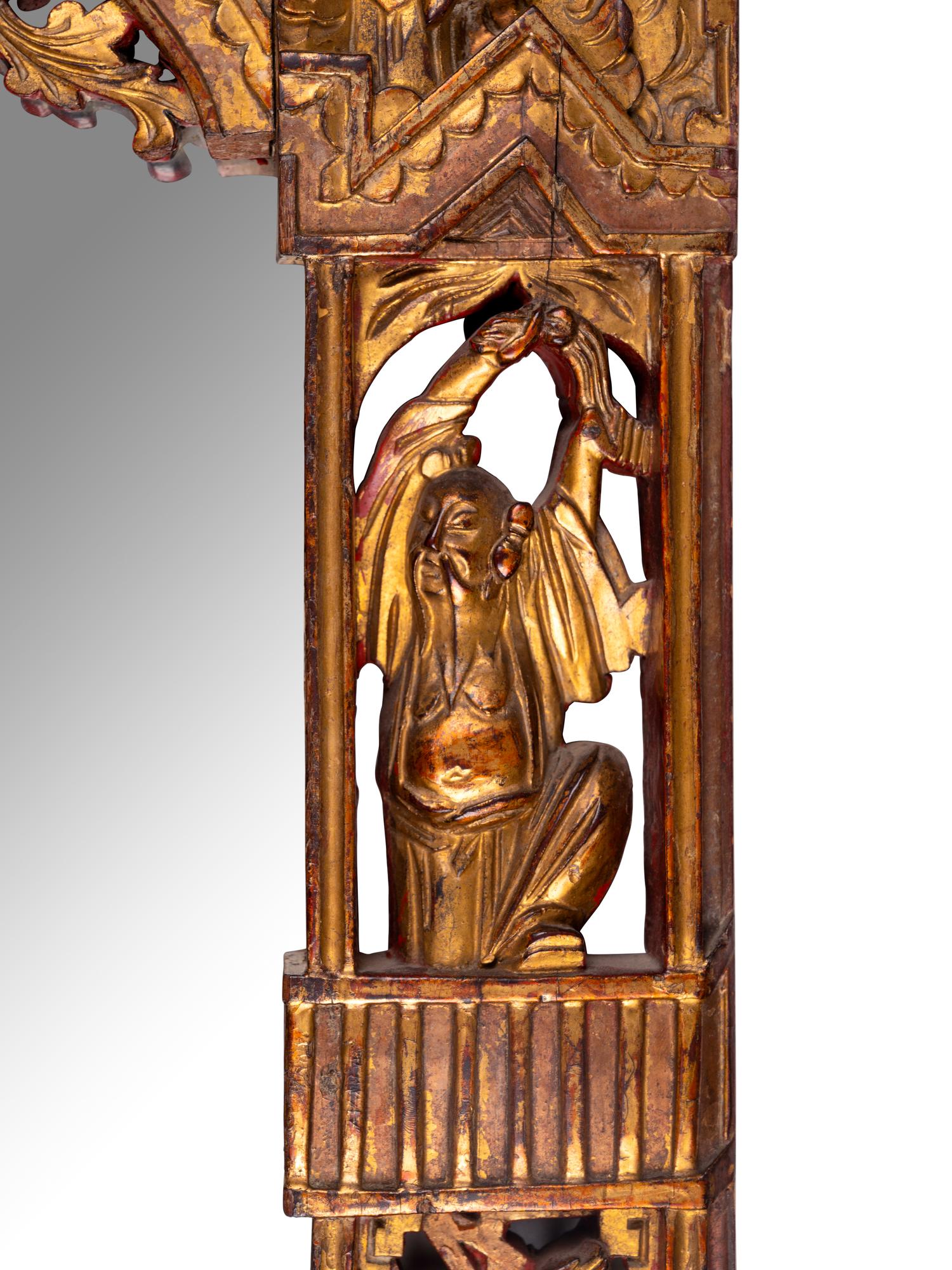 A Chinese Red and Gilt Lacquered Carved Wood Mirror