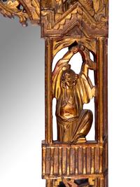 A Chinese Red and Gilt Lacquered Carved Wood Mirror