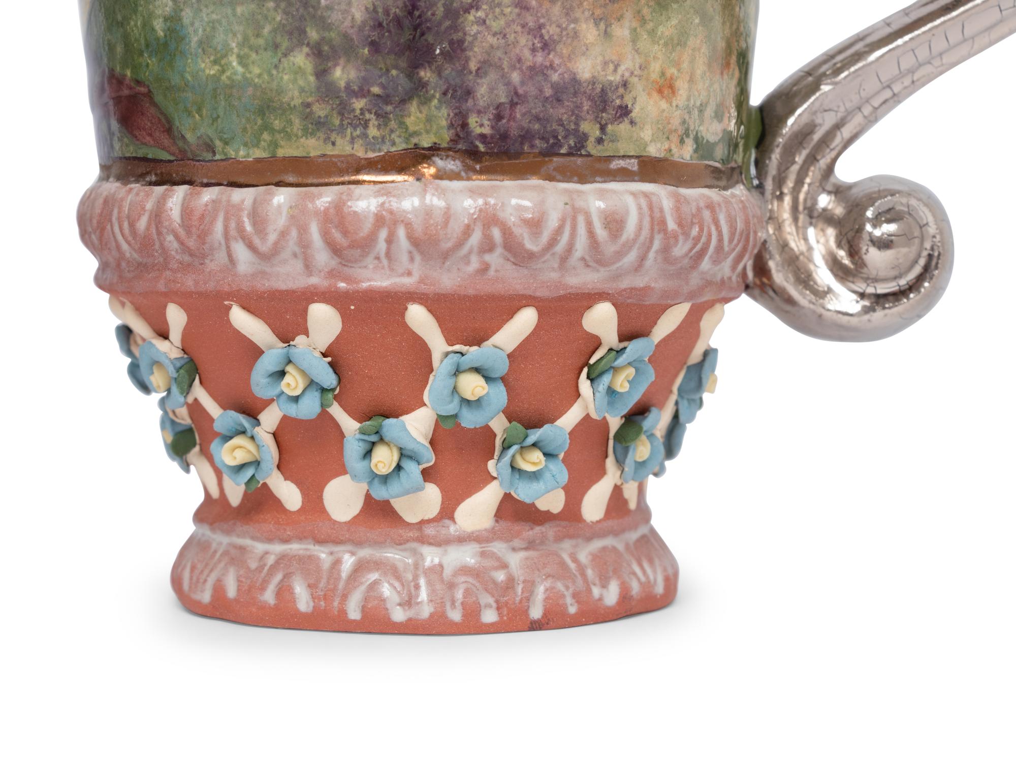 A Set of Fourteen MacKenzie-Childs Evervolving Ceramic Mugs