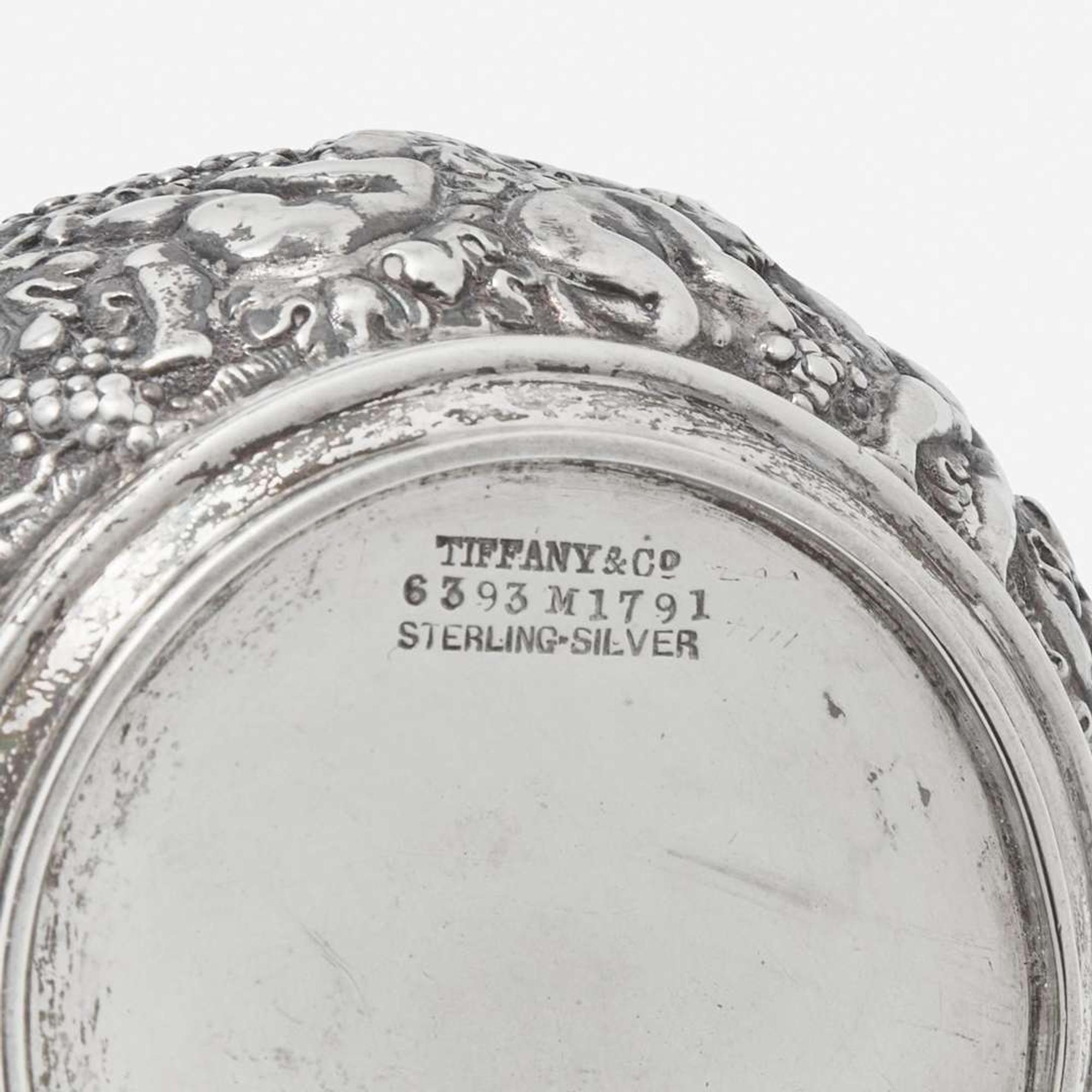 A three-piece sterling silver repoussé tea service Tiffany & Co., New York, NY, 1870-1891