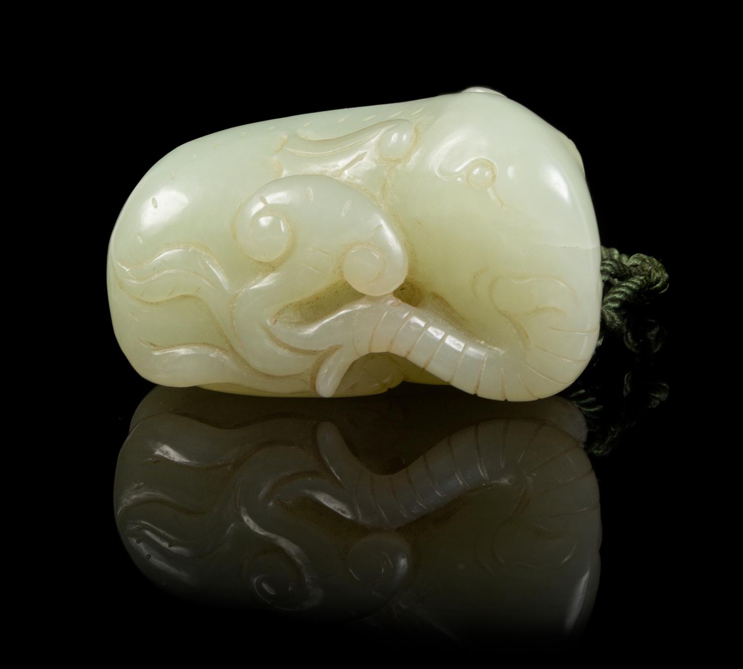 A Carved Jade Toggle Length 2 inches.