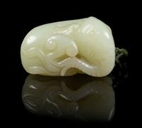 A Carved Jade Toggle Length 2 inches.