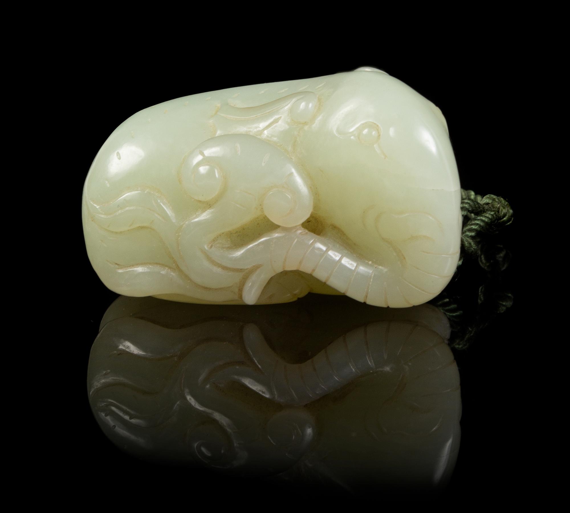 A Carved Jade Toggle Length 2 inches.