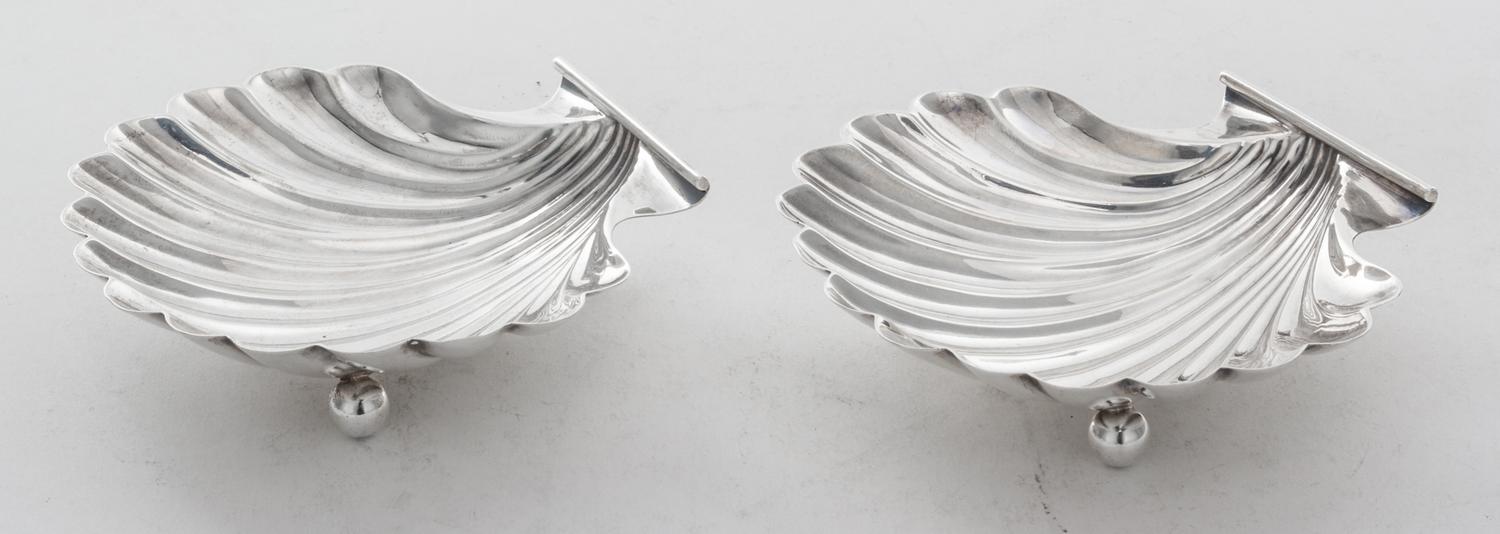 A Pair of American Silver Shell Form Salts, Currier & Roby, New York, NY, raised on three ball feet.