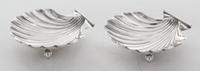 A Pair of American Silver Shell Form Salts, Currier & Roby, New York, NY, raised on three ball feet.