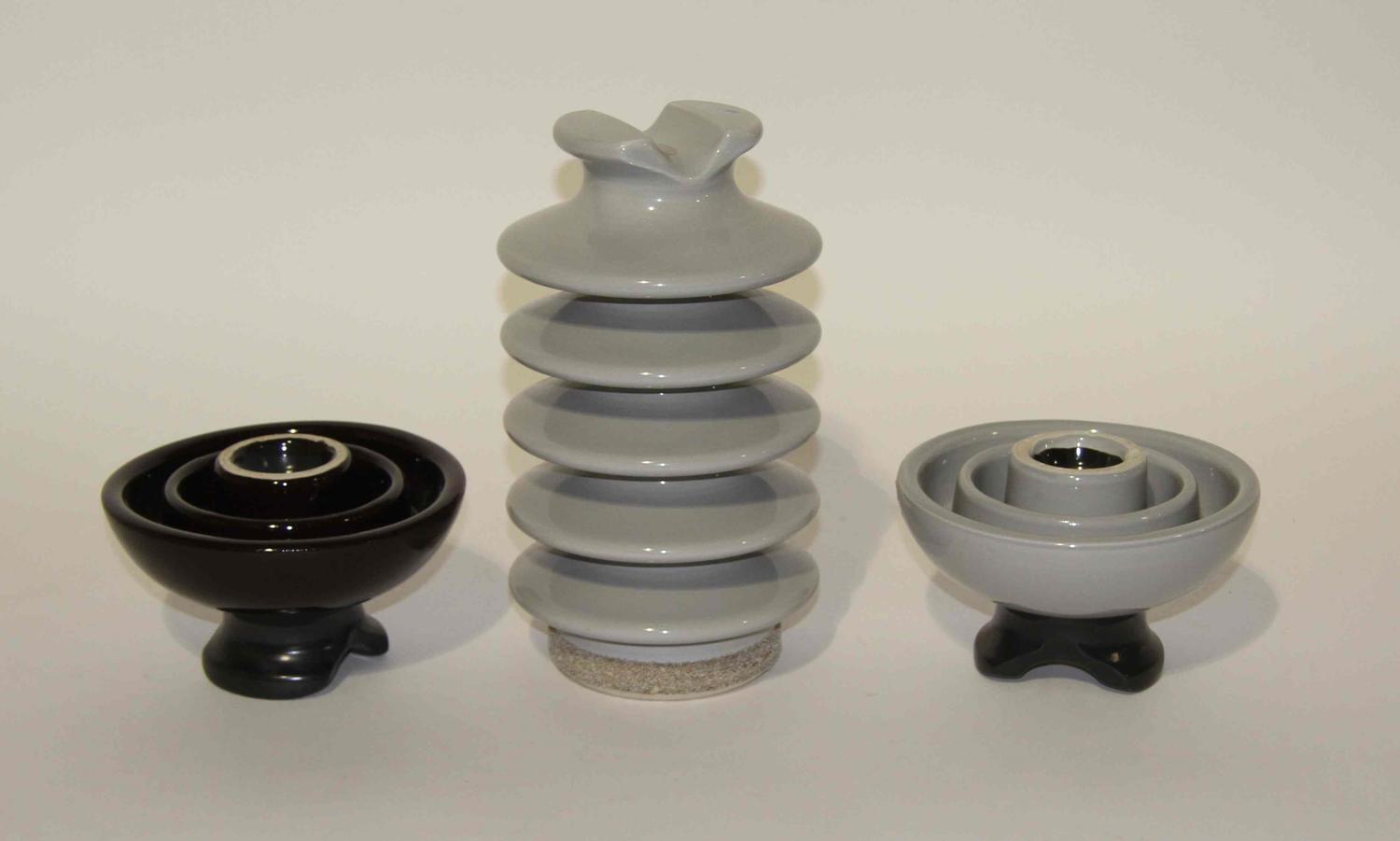 Three Haeger Pottery Insulators Height 11 1/2 inches.