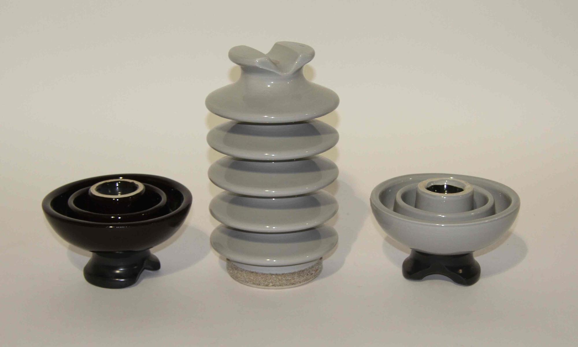 Three Haeger Pottery Insulators Height 11 1/2 inches.